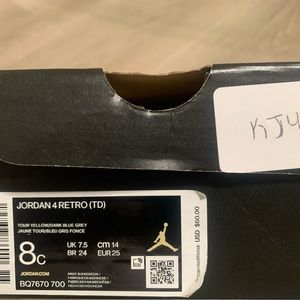 Yellow and Gray number 4 Jordans